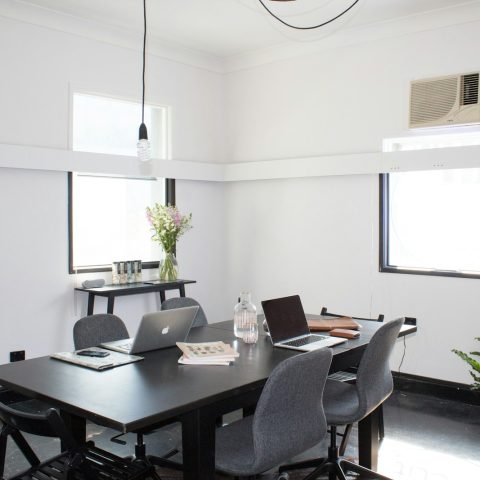 rectangular brown wooden table with chairs