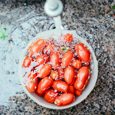 orange beans on white container soaked in water