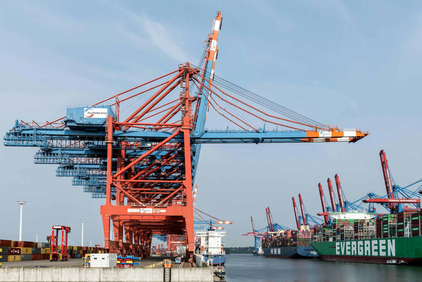 A large crane sitting next to a large ship